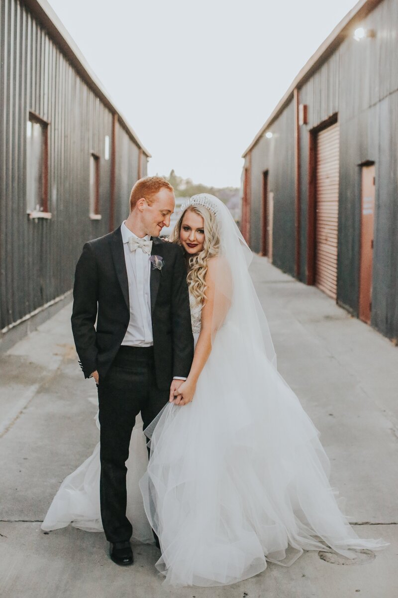 bride and groom holding eachother