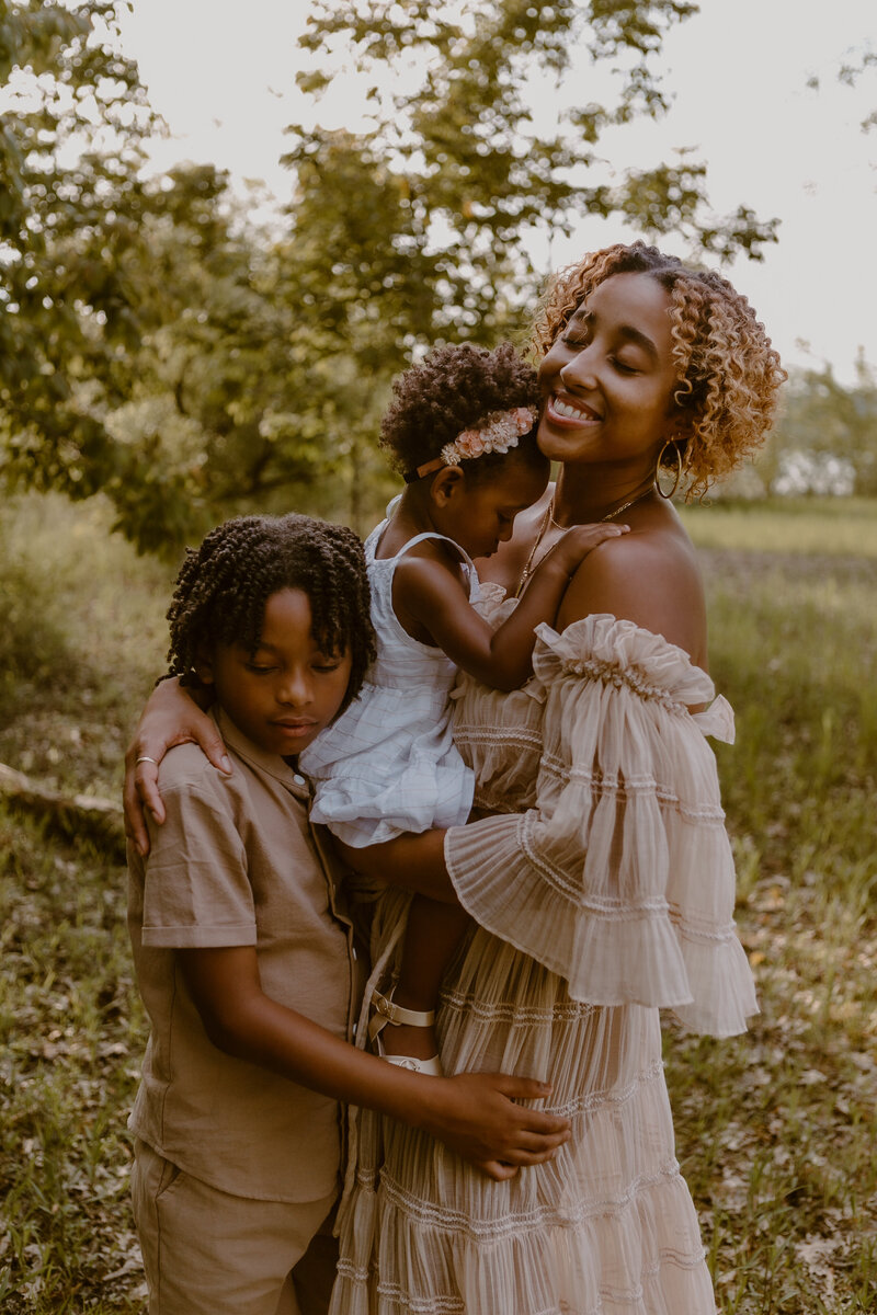 Photo of a mother hugging her two children during her Family Photoshoot in Bloomington, Indiana