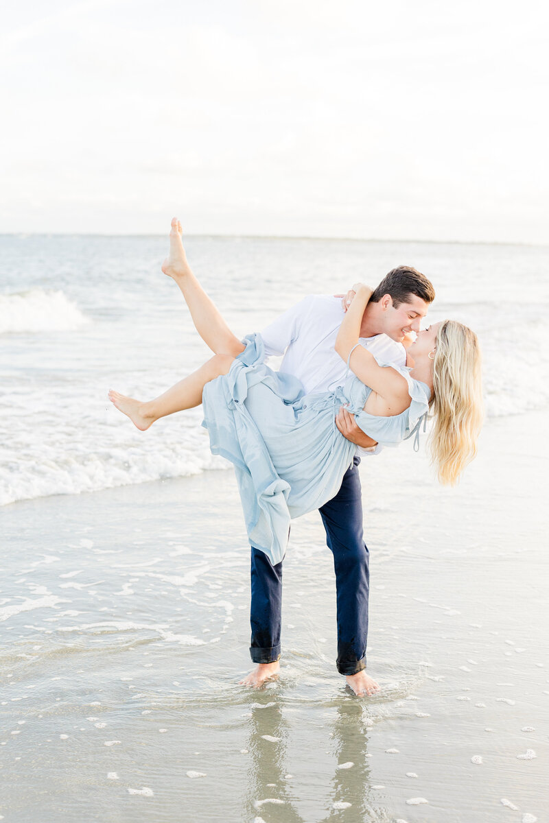 couple laughing in ocean at sullivans island