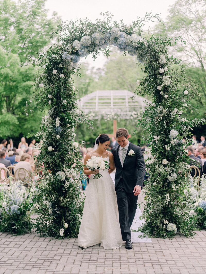 Couple gets married under a luxury floral arch in Georgia