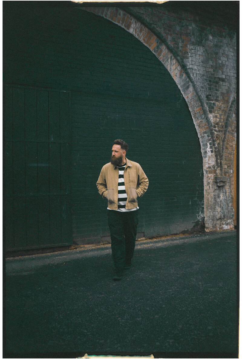 An untraditional wedding photographer posing a cool boho couple