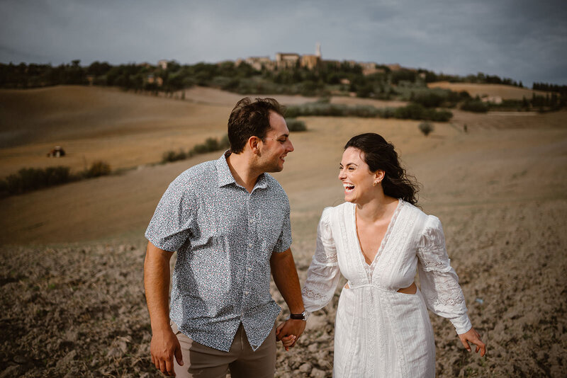 bride and groom to be enjoying their photo shoot in the Tuscan countryside