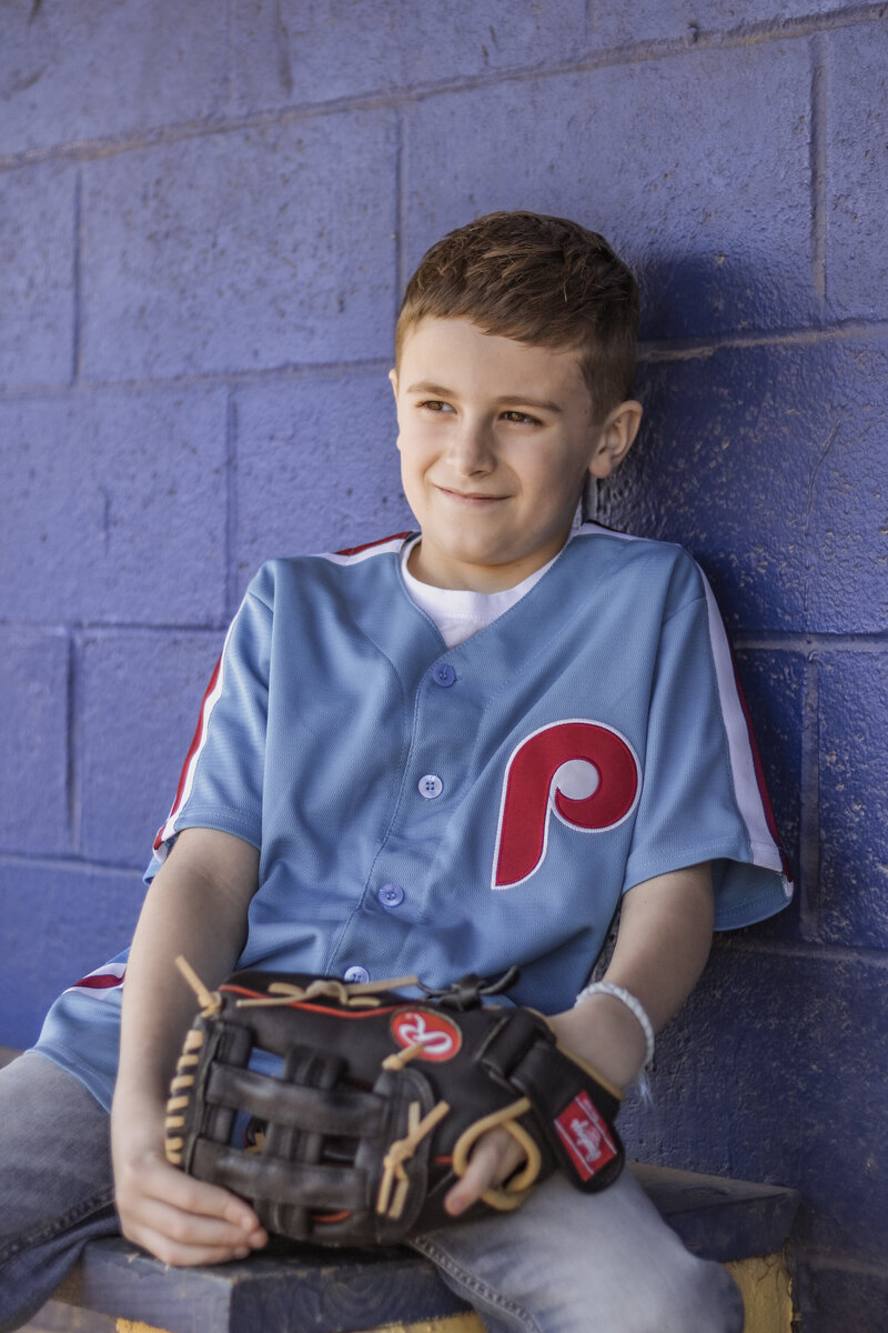 kid in baseball dugout