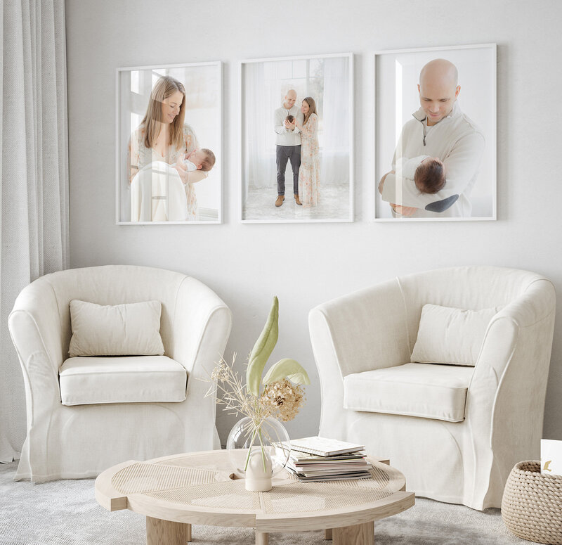 set of framed portraits hanging in living room designed by massachusetts photographer