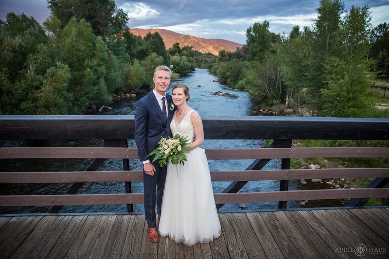 Aurum Food & Wine Wedding Photo on nearby bridge with Mount Werner in the distance Steamboat Springs