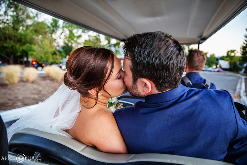 Kissing on a Golf Cart The Barn at Raccoon Creek in Littleton Colorado