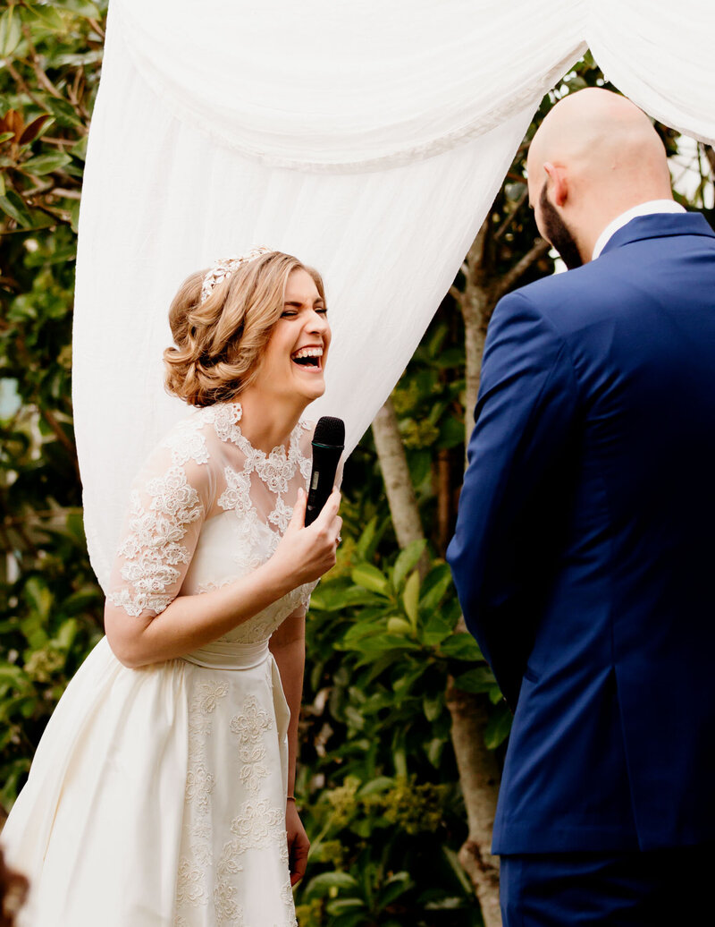 Bride laughs at wedding ceremony