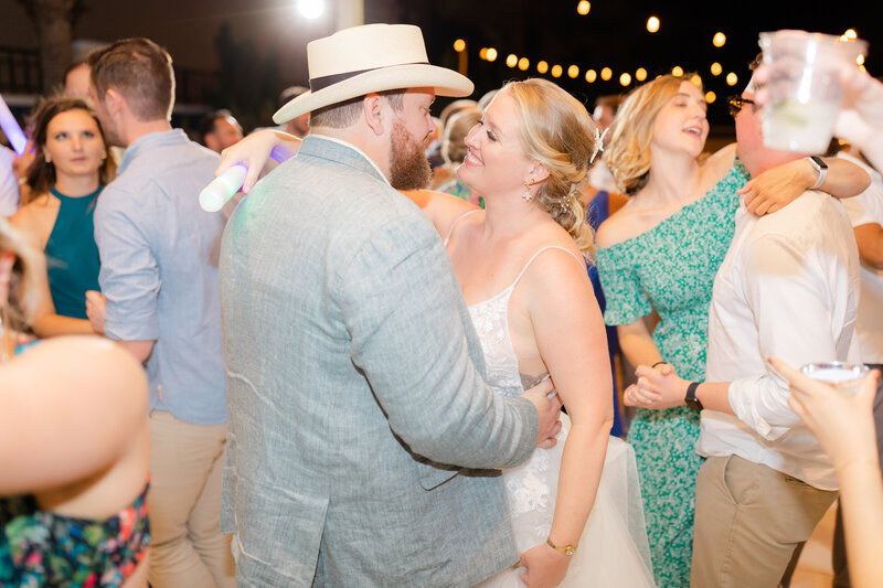 Brid and groom embraced and dancing amongst their wedding guests in Ponte Vedra