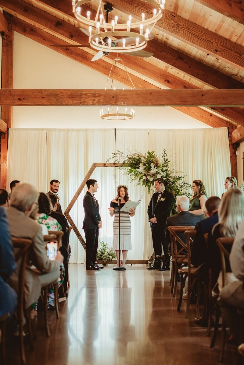 indoor wedding ceremony at barnwood events in madison, winconsin.
