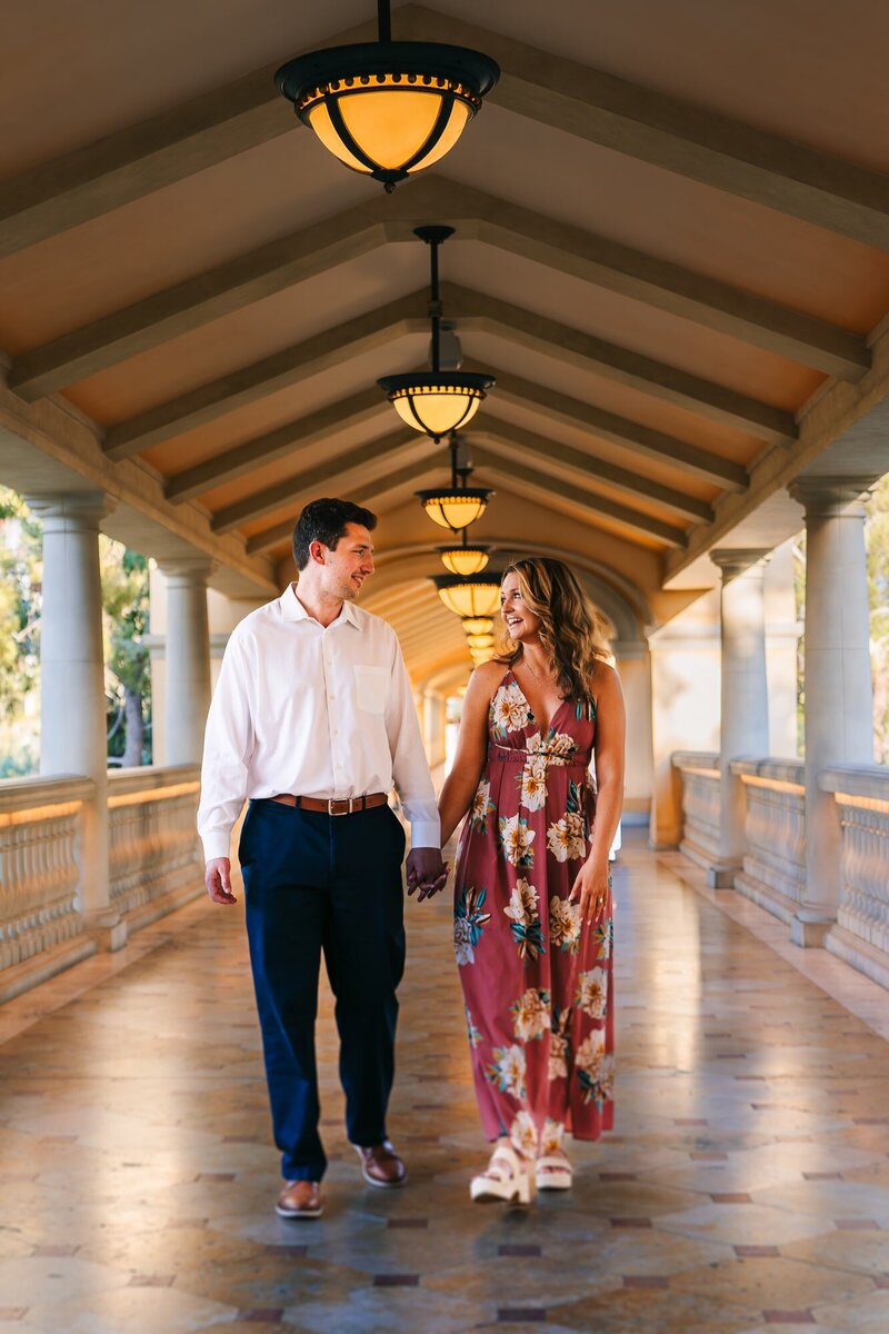 A couple having a fun stroll during their engagement session in Las Vegas.