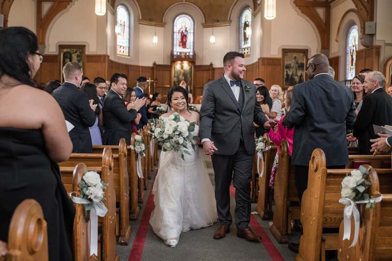 interacial wedding couple recession in church