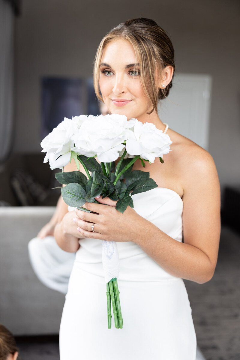 Photo by GreenPoint Photography Bride Holding White Rose Bouquet