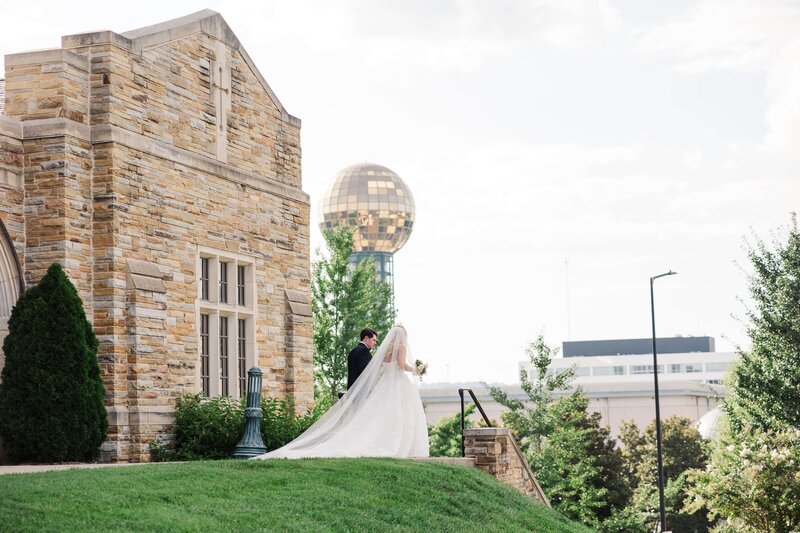 knoxville sunsphere behind bride and groom by knoxville wedding photographer