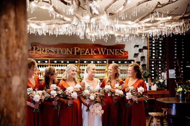 Bridal party under the chandelier and Preston Peak sign
