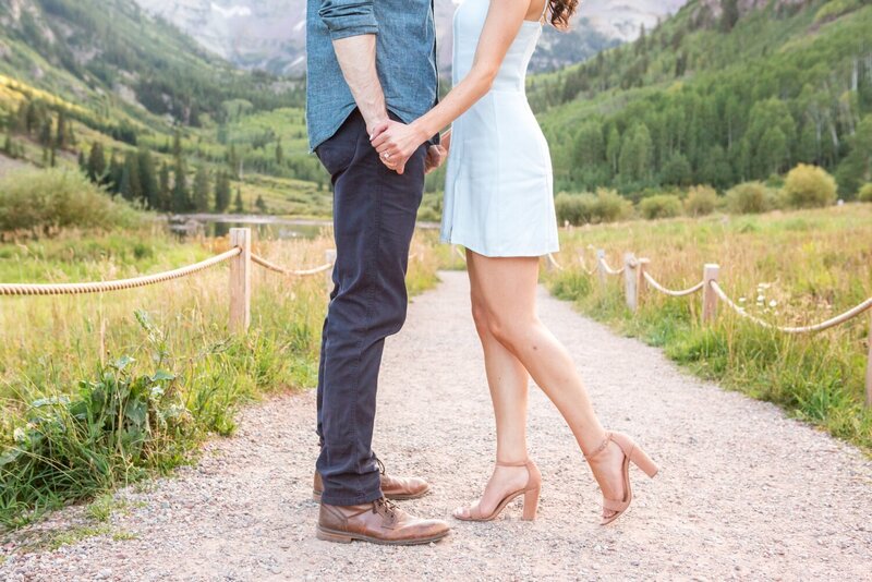 Proposal photos in Colorado ring and holding hands
