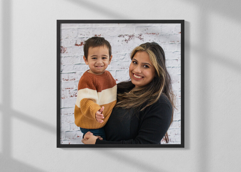 Framed wall portrait of Mom  and two year old son taken at the Life in Pink Photography studio  near Madison, Wisconsin