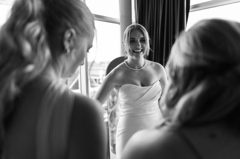 This is a GreenPoint Photography image of a bride getting ready with her bridesmaids