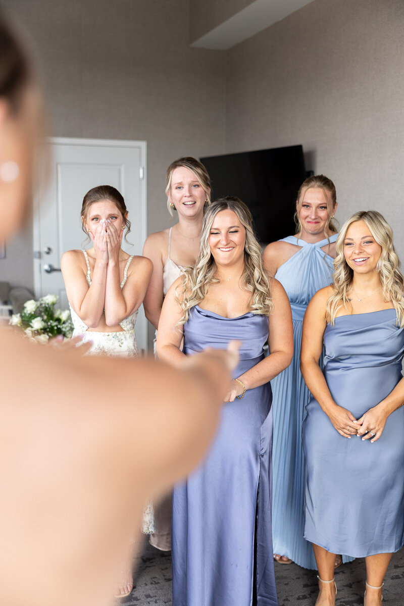 Photo by GreenPoint Photography Bridesmaids seeing Bride in dress for the first time