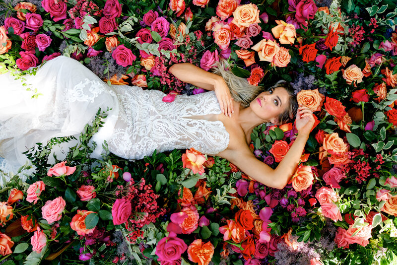 Aspen-Avenue-Florida-Wedding-Photographer-Miami-Villa-Woodbine-Dorasasu-Doll-Haus-Glam-Intrigue-Design-Unique-Colorful-Bride-Laying-In-Florals