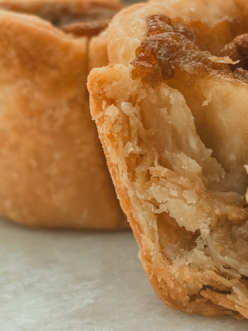 Flakey layers of crust from out jumbo pecan butter tart. locally made in Larder Lake.  Delivered in Norther Ontario. 