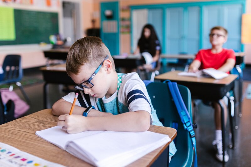 Student working at his desk taking a test