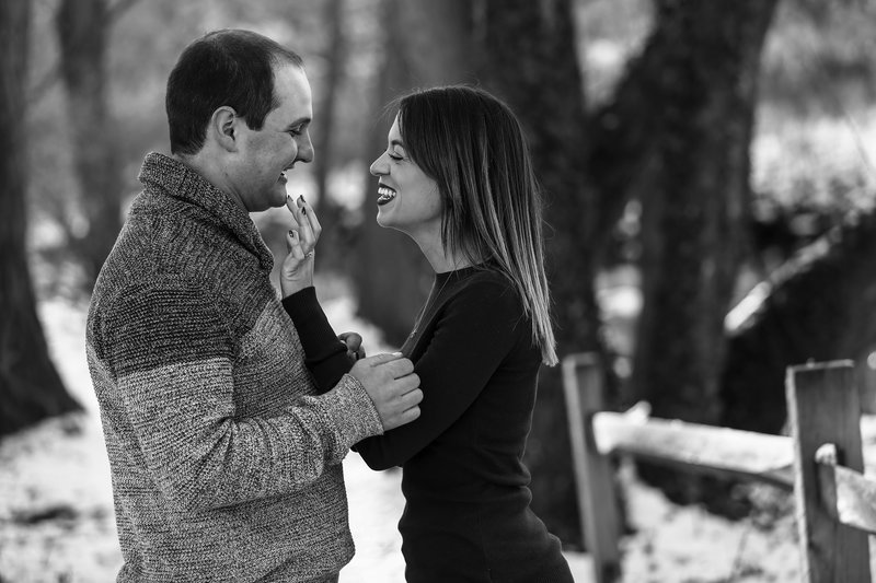 Erie, PA woman wipes lipstick from fiance's face during Frontier Park engagement photos