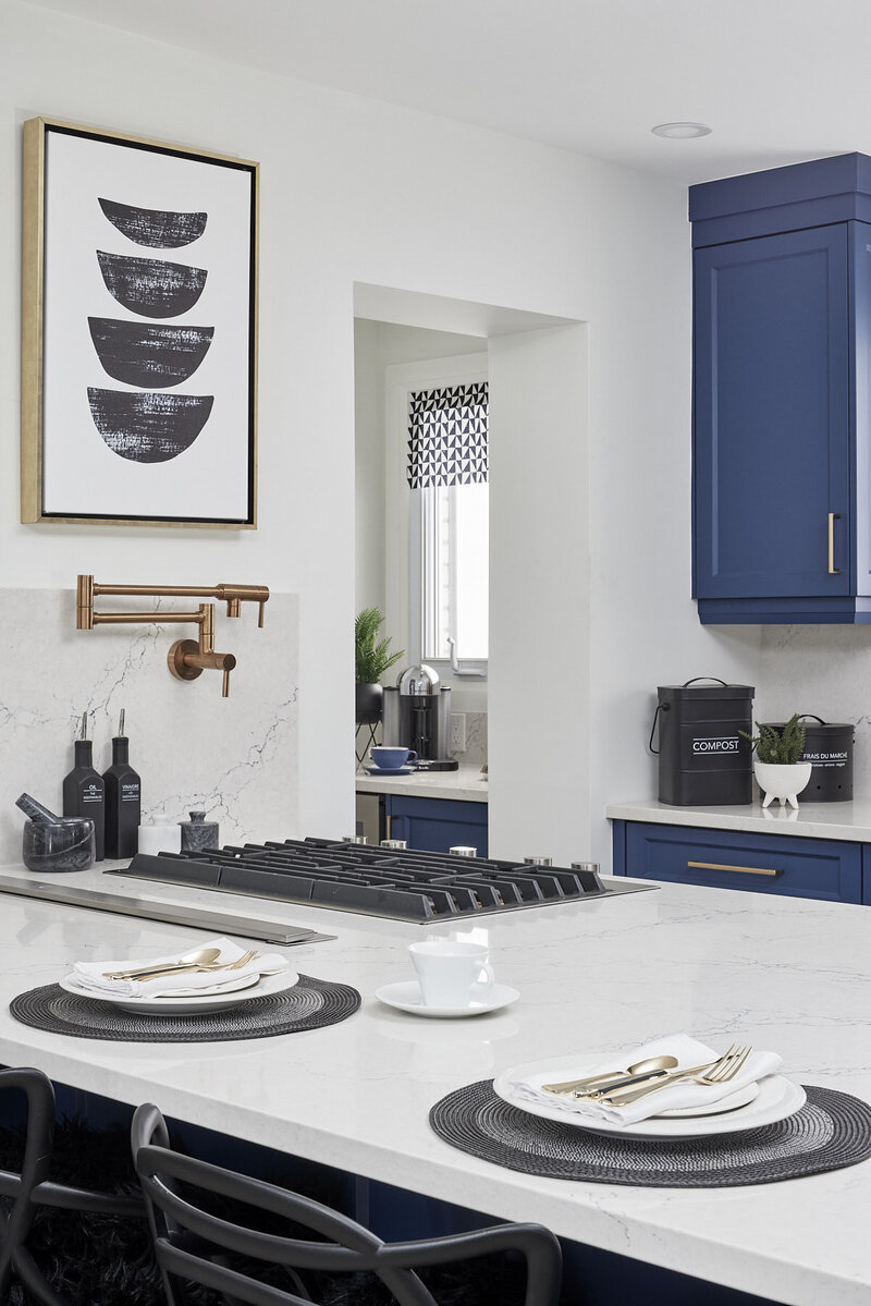 White kitchen with blue cupboards