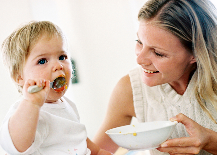 Thrive by Spectrum Pediatrics image for thrive today is a child happily eating with mother during mealtime