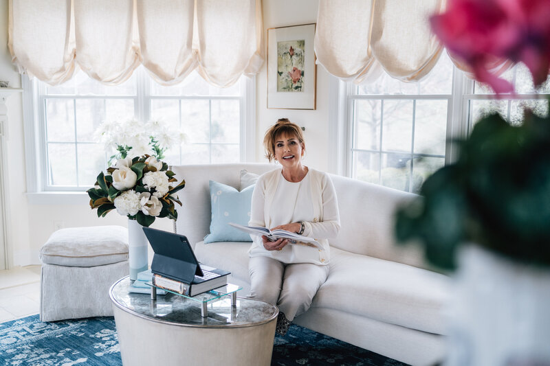 Interior designer, Charisse Marei, sits in her living room