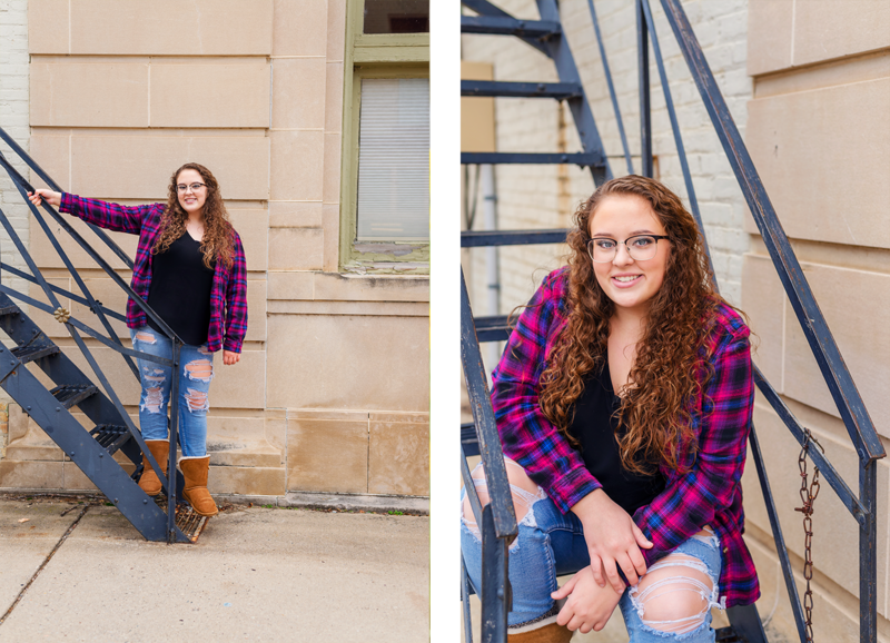 high school senior girl posed on fire escape stairs downtown  portland michigan