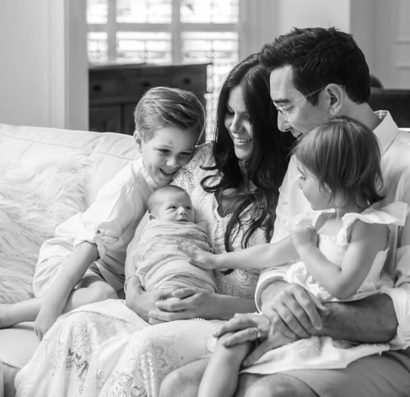 happy family with newborn black and white photo