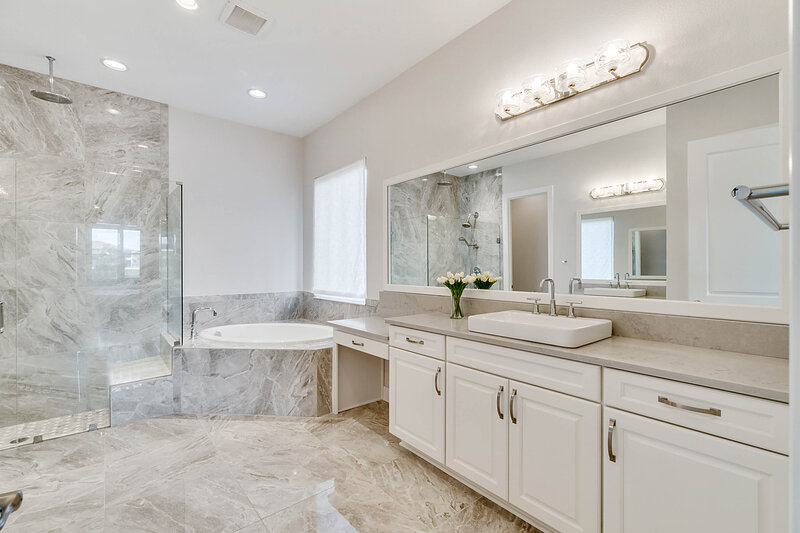 bright, white high-end home master bathroom in Orlando