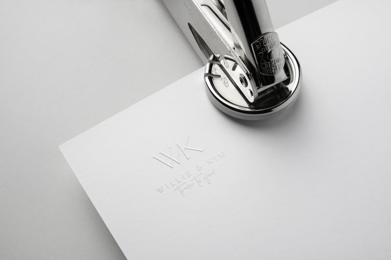 Behold the essence of me craft – a symbol of bespoke excellence. Witness a brand logo meticulously stamped onto paper, showcasing the artistry of a custom web design process at Elite Experience