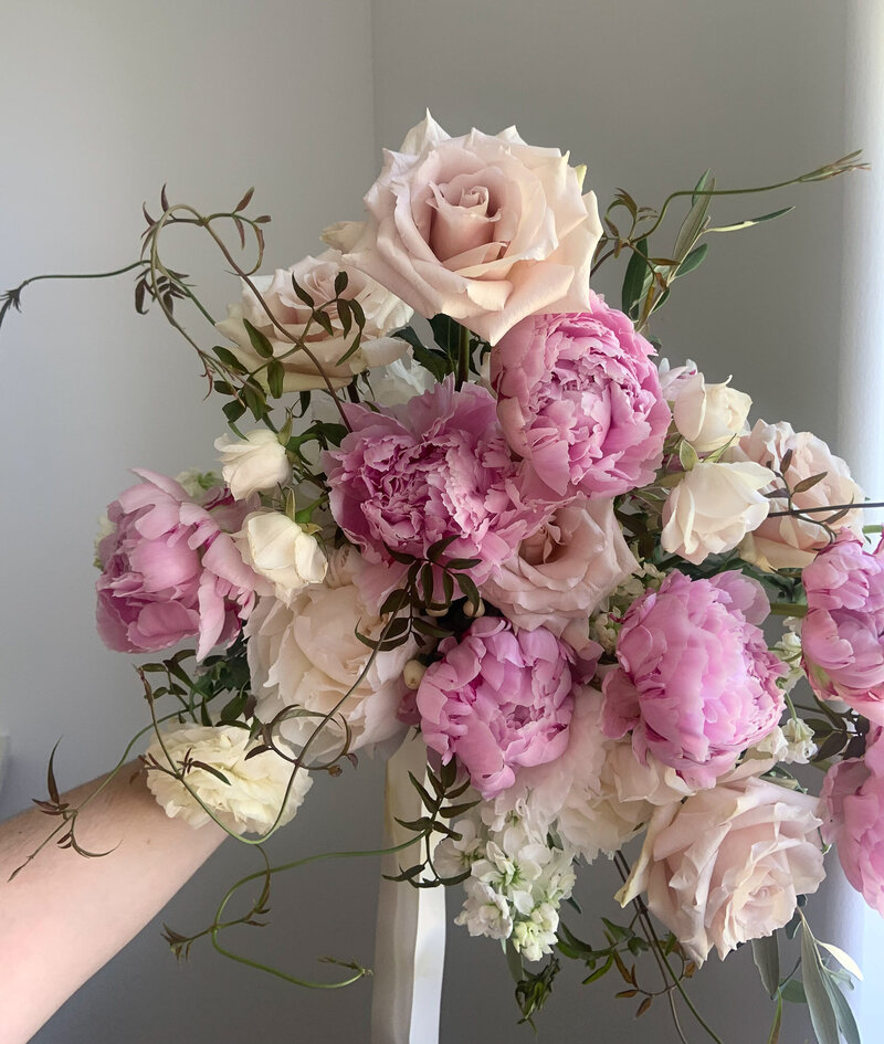 Light and airy blush and white bouquet with peonies and roses.