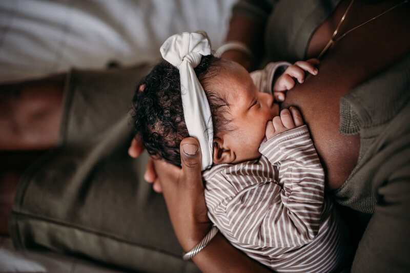 Breastfeeding photo in newborn photoshoot