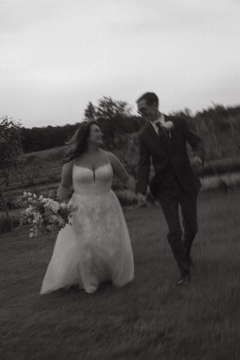 Bride and groom dancing in front of an old vintage church