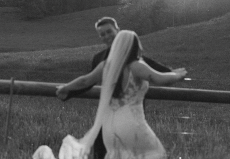 Blurry black and white image of a dancing couple.
