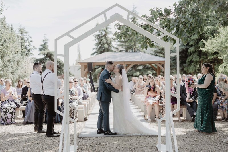 First Kiss Wedding Ceremony Photo Edmonton Pioneers Cabin