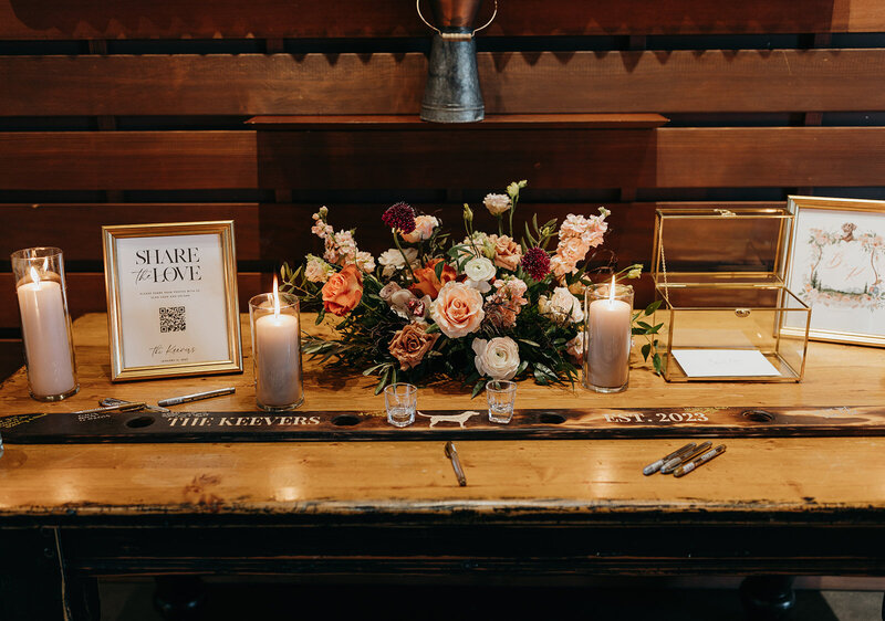 Welcome table at Brasada Ranch with candles and floral arrangement