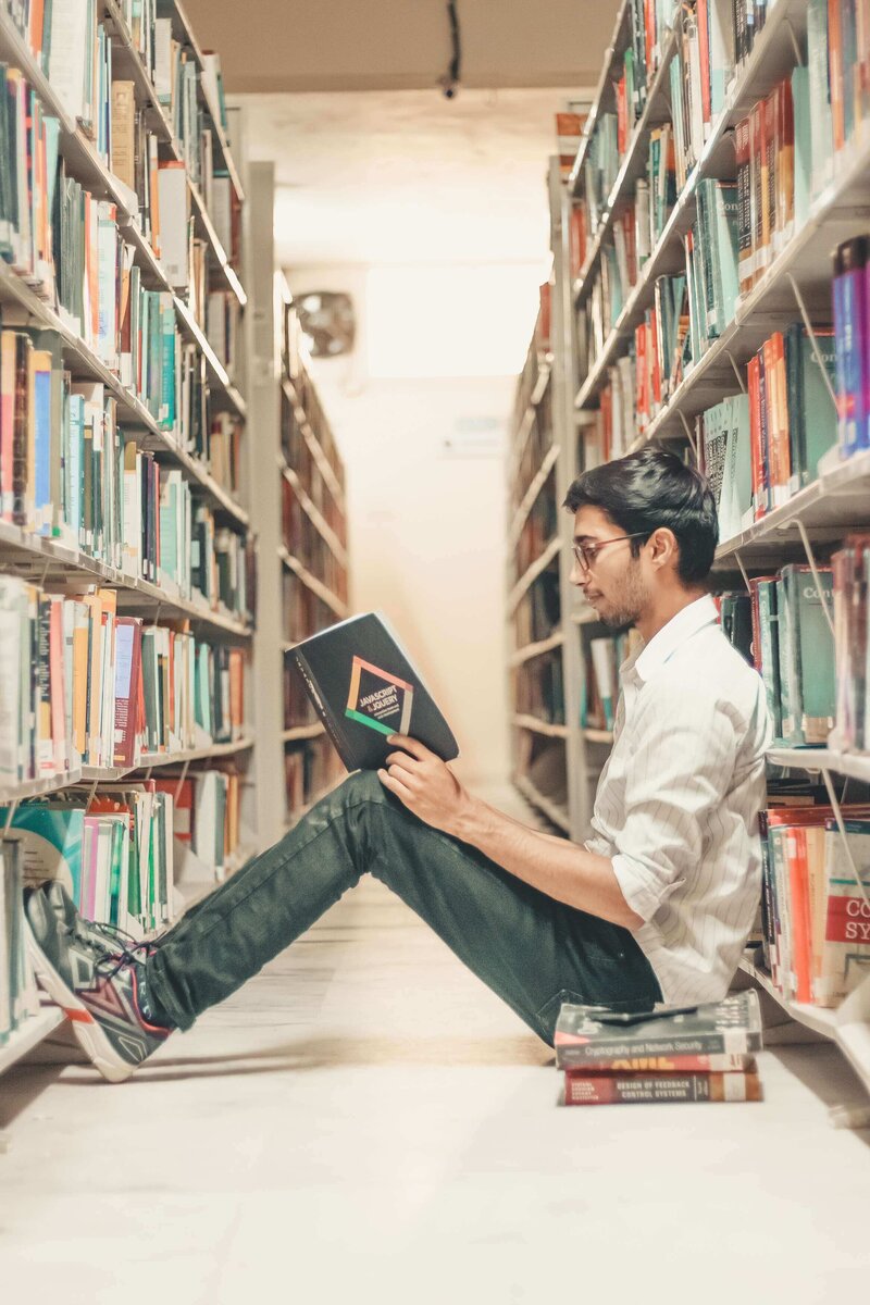 College student studying in university library