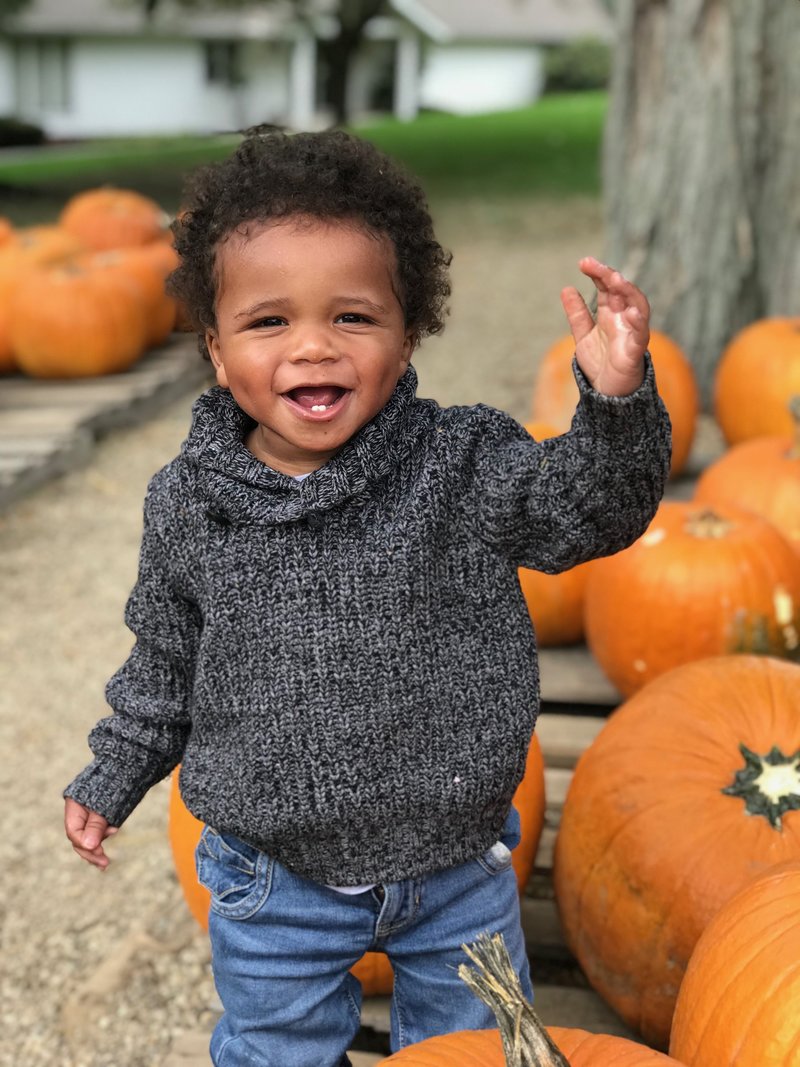 cute boy with pumpkins