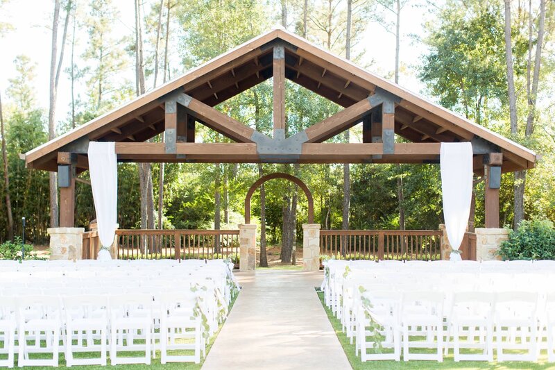 outdoor-wedding-ceremony-white-chairs-eucalyptus