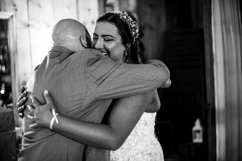 Bride and father hugging at Port Farms
