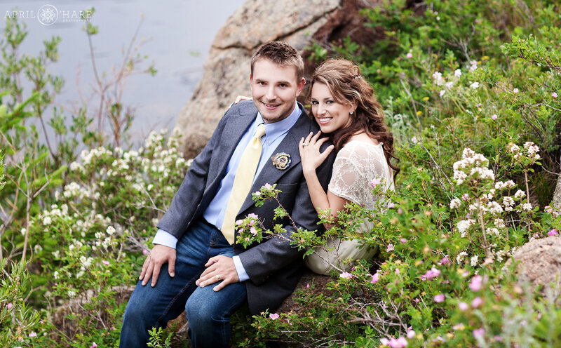 Couple with wildflowers during their summer wedding at Rocky Mountain National Park in Colorado