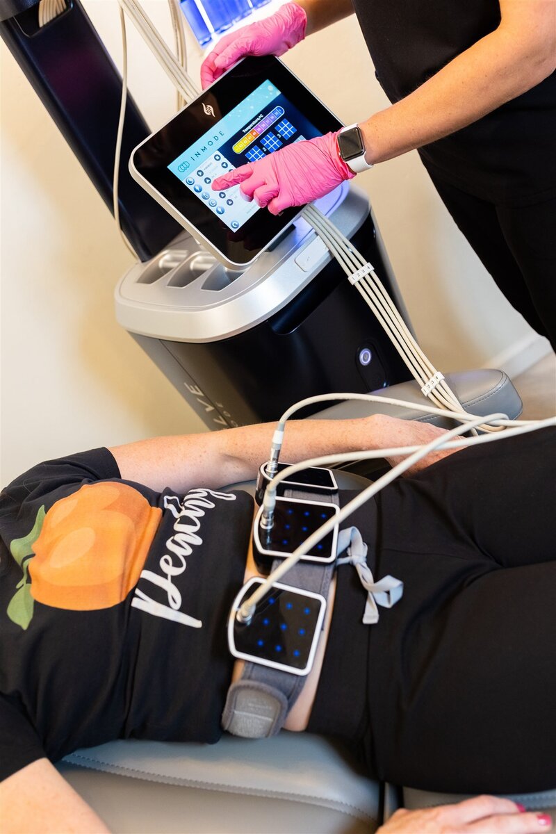 A client that is using the EvolveX device to help reduce fat and tone their abs