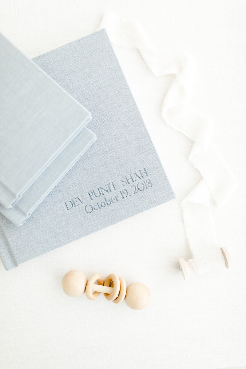 Light blue linen-covered baby albums