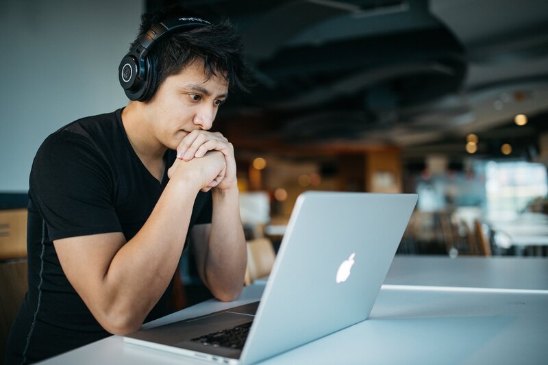 Man staring at computer with worry about life after military
