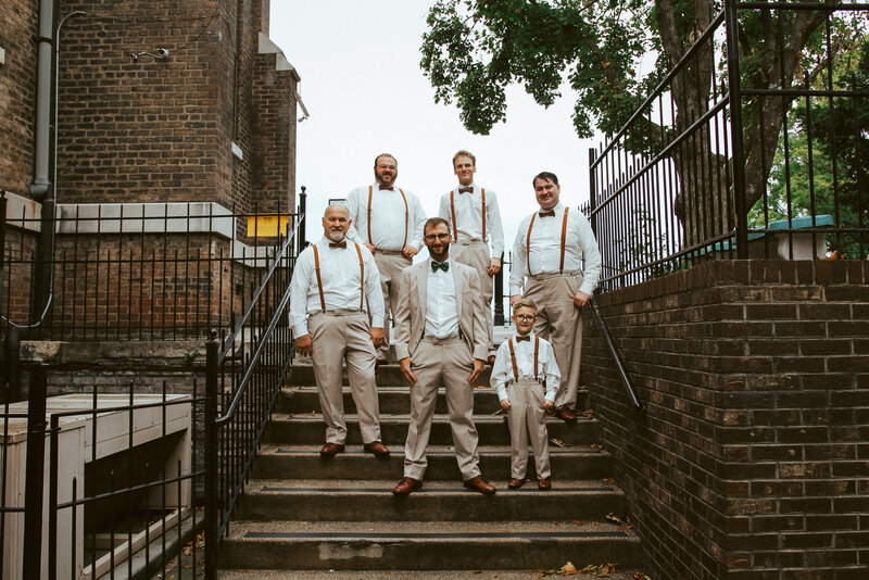 groomsmen on steps of church