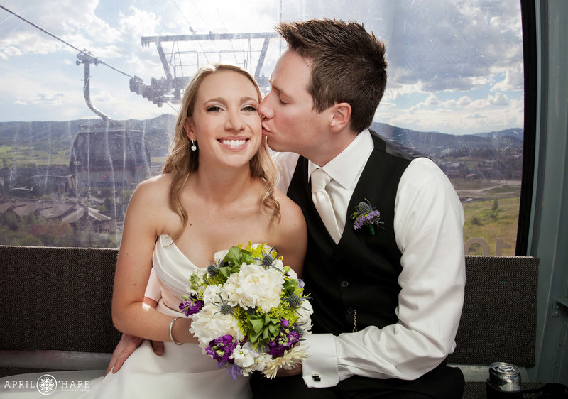 Couple enjoys the gondola ride on their wedding day at Steamboat Springs Ski Resort in Colorado
