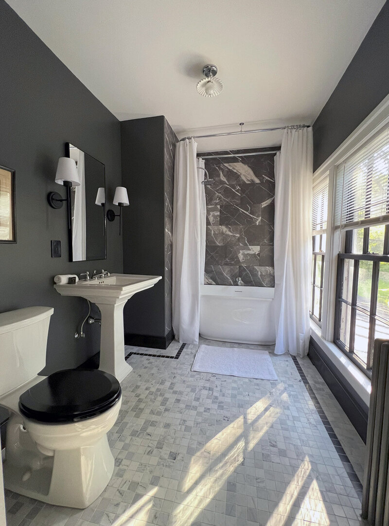 Sunny bathroom with marble tiles